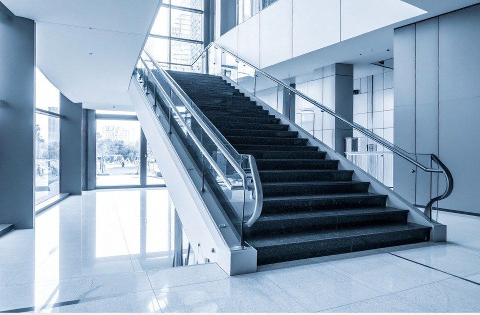 Modern commercial lobby with grand staircase