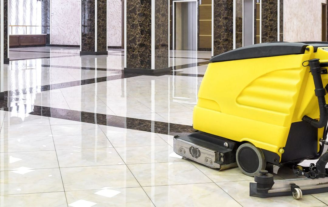 Machine cleaning a commercial hard floor